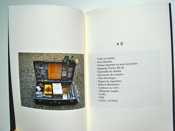 Valise en métal. Rose blanche. Poème imprimé en noir sur jaune. Page # 8 du livre K de David Taieb